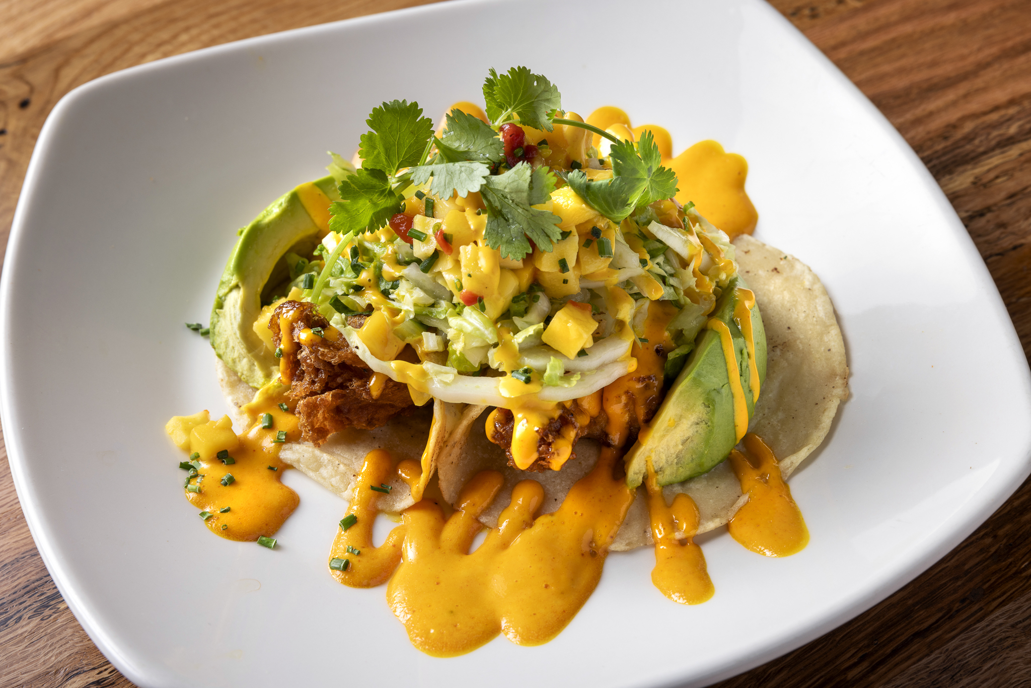 Fresh fish tacos with crisp slaw, house-made sauces, and bold coastal flavors, perfect for a sunny Palm Desert day