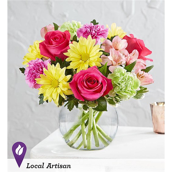 Vibrant Gem Bouquet LOCAL ARTISAN For anyone who is a true gem in your life, our bright, happy bouquet will make their eyes light up. Pretty pink, yellow and magenta blooms are gathered inside a sleek bubble bowl vase to play up their beauty. Designed by Ashlee Rae Roberson from Simply Roses in Ormond Beach, Florida, this vibrant gift is sure to make a big impression.