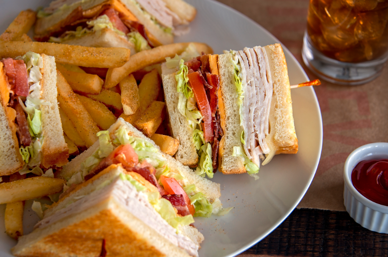 You do not want to miss out on our Turkey Club Sandwich! Slow-roasted turkey breast, hickory-smoked 