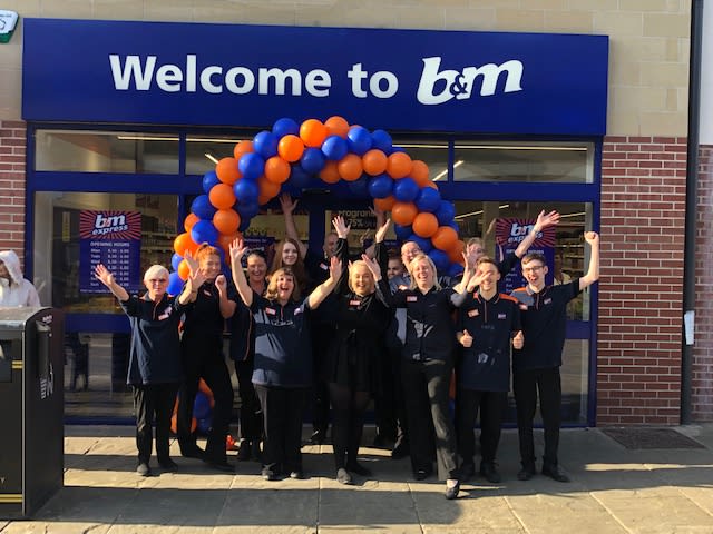 The store team at B&M's newest store in Rothwell pose in front of their wonderful new B&M Store, located on Commercial Street.