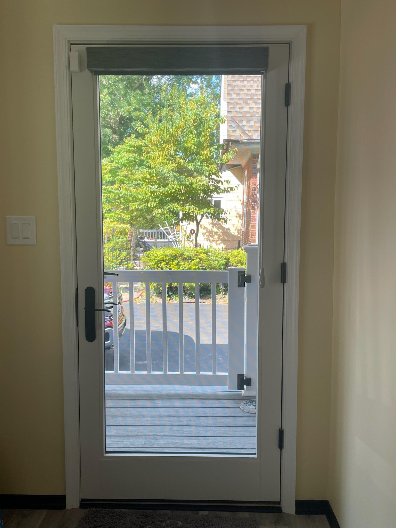 Roller shades are great for doors. They fully tuck into the cassette top treatment for maximum light allowance.