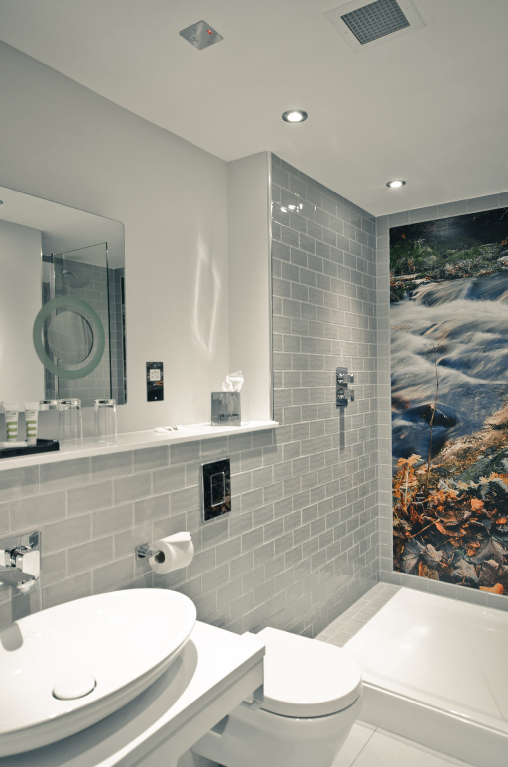 Superior room wet room shower with photographic mural on wall of nature scene and grey tiles Mercure Edinburgh City Princes Street Hotel Edinburgh 01313 421013