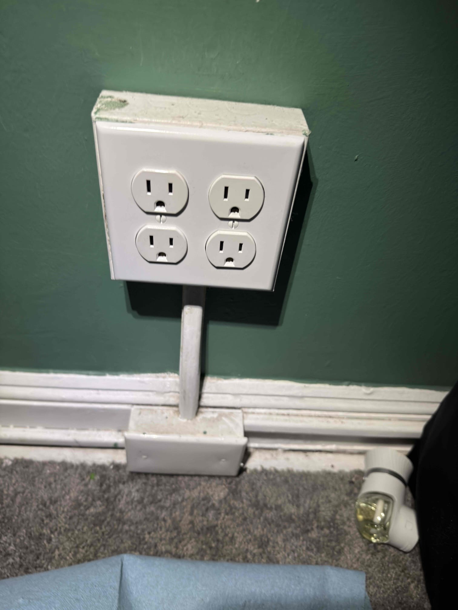 Thomas Edison Electric installed a surface-mounted quad outlet with Wiremold raceway in a Drexel Hill, PA home. The four-plug configuration provides extra capacity in a room that needed more receptacles without opening up the walls.