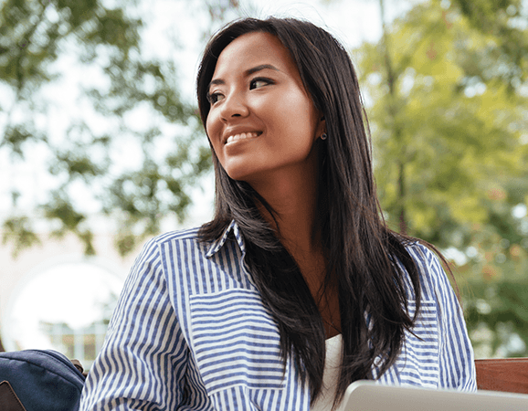 woman smiling with a laptop