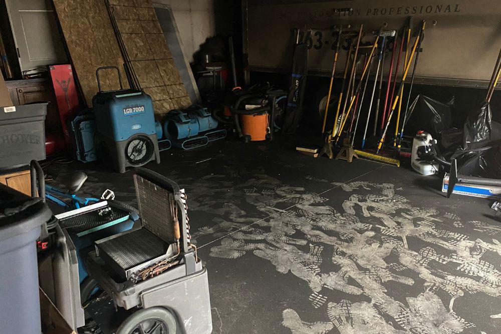 Fire damage soot removal.  Pictured here is soot on a shop floor from a fire.