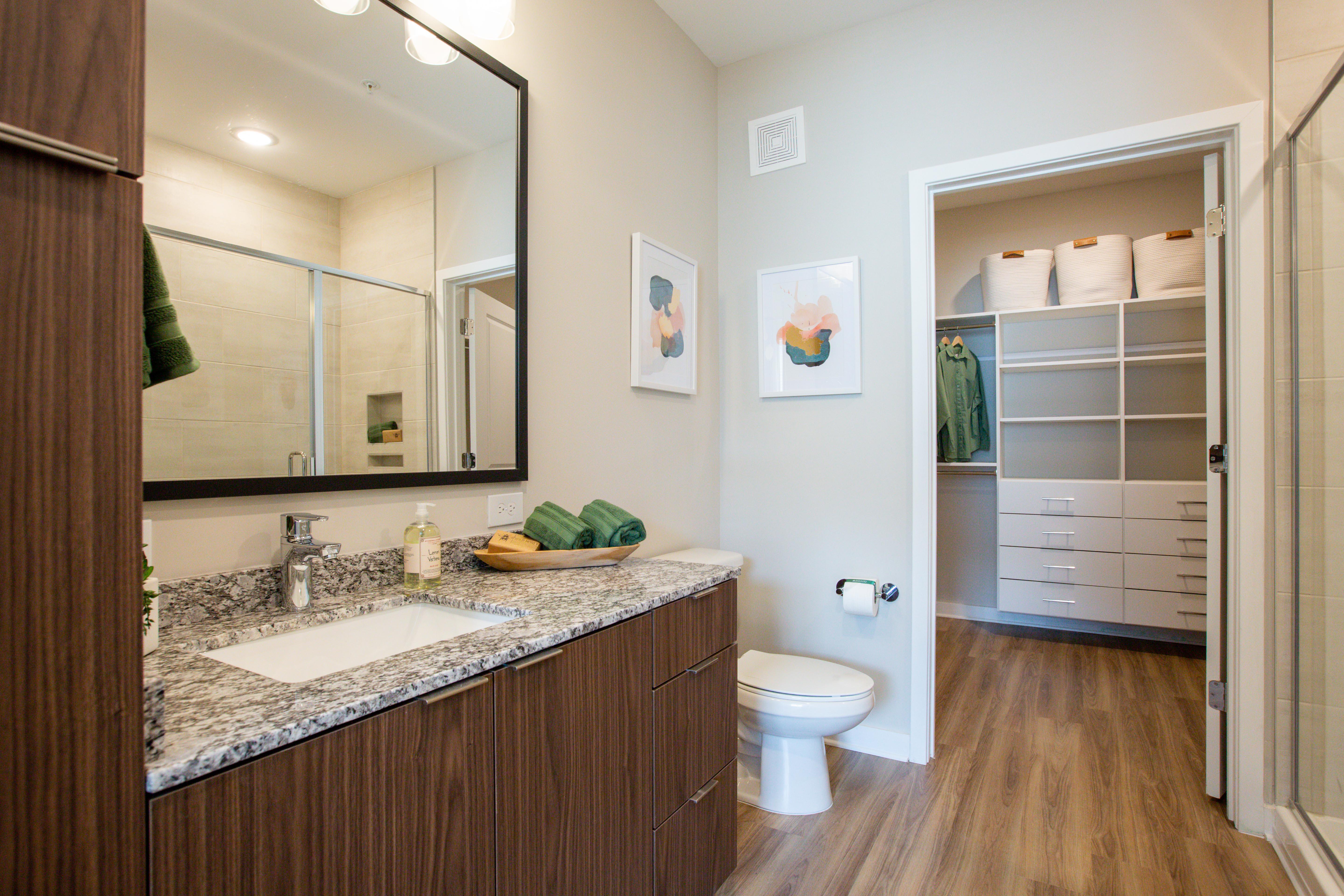 Spa-inspired baths featuring spacious linen towers.