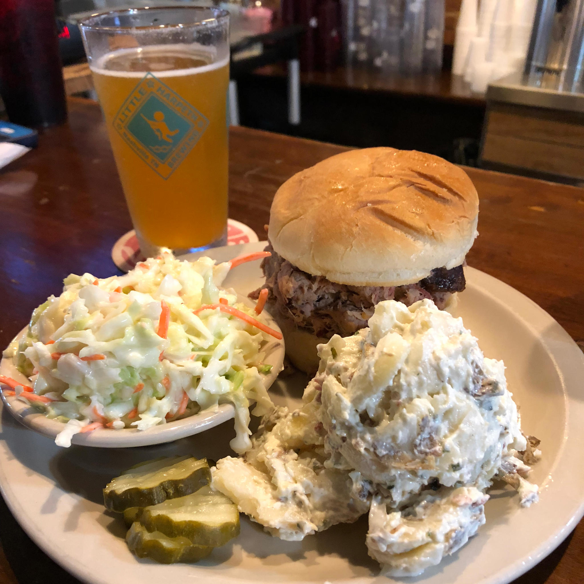 Pulled Pork BBQ Sandwich with Coleslaw and Loaded Potato Salad