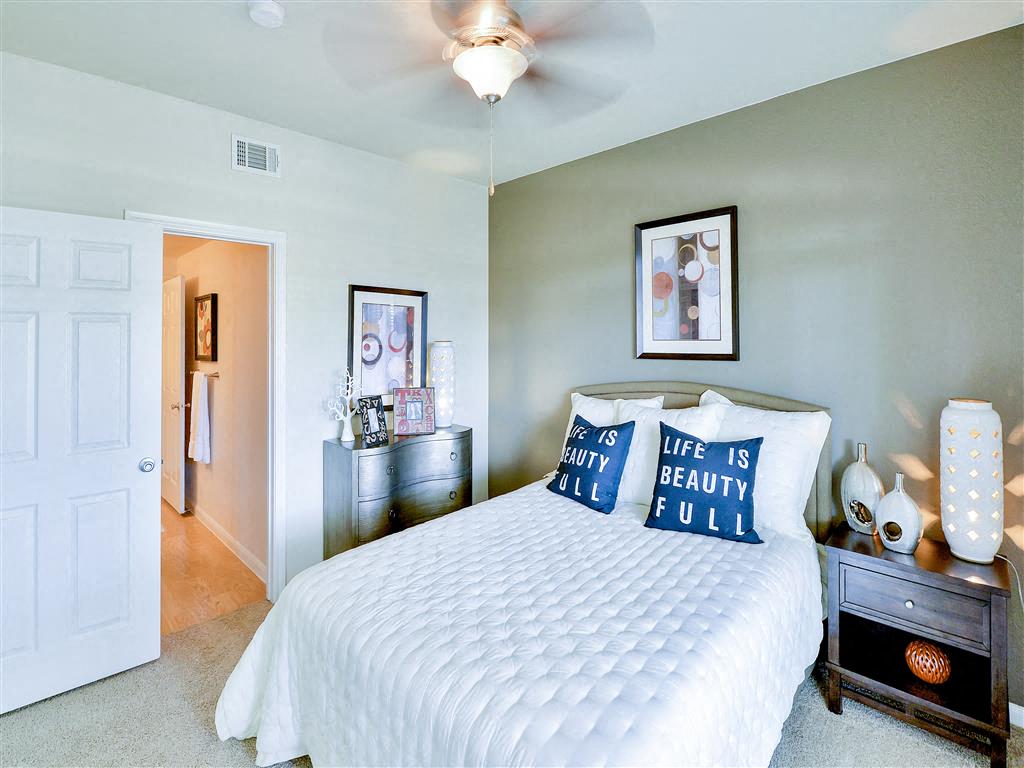 Spacious bedroom with ceiling fan