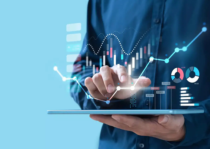 A professional holding a tablet with an overlay of financial graphs.