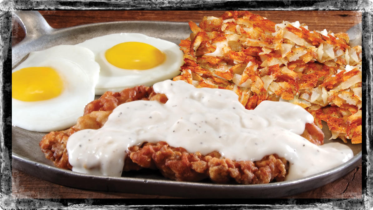 Chicken-Fried Steak & Eggs* - Classic chicken-fried steak, deep fried to a golden brown and smothered with creamy white pepper gravy. Served with hash browns or fresh fruit and choice of toast, biscuit or two hotcakes