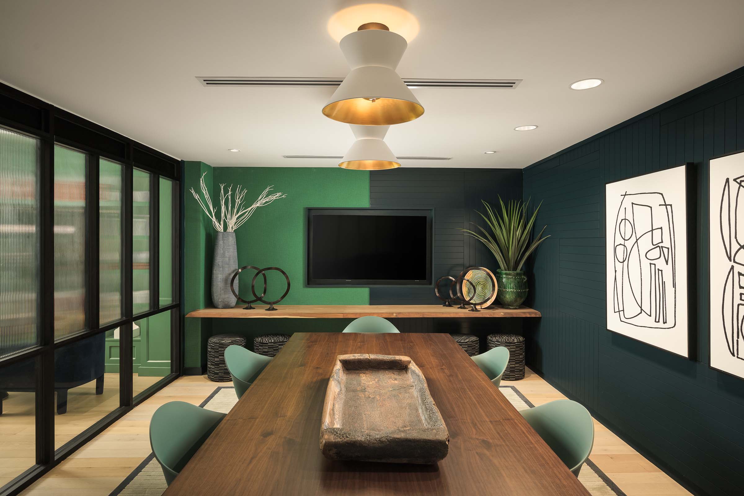 Resident lounge conference room with tv at Camden Gilbert apartment homes in Gilbert, AZ