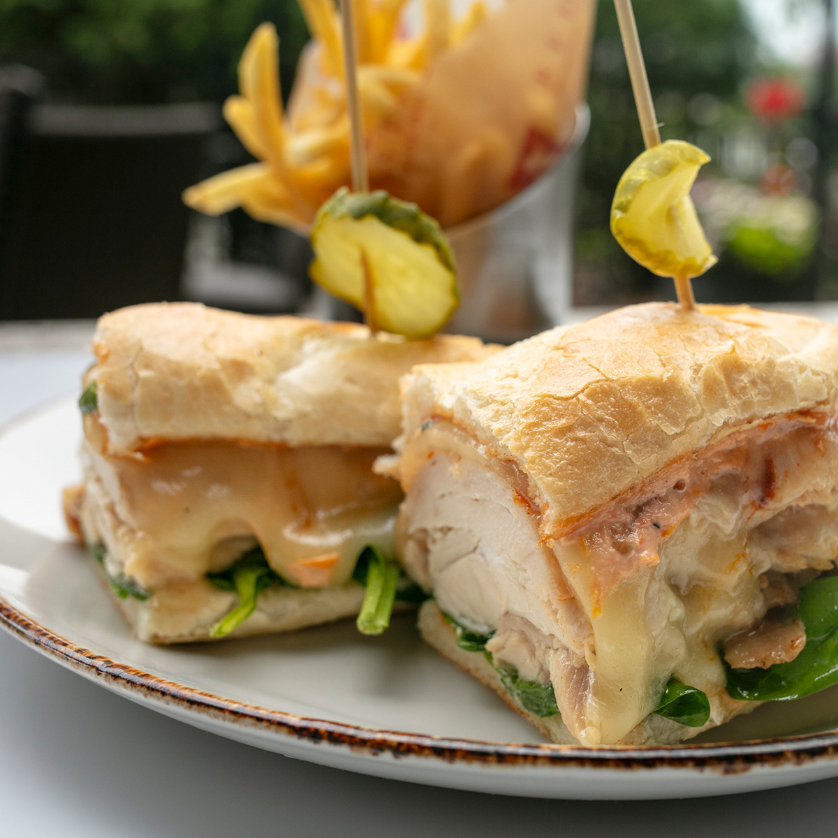 Rotisserie Chicken Sandwich | monterey jack, tomato aioli, pickles, spinach & lemon garlic oil, toasted hoagie, chicken au jus