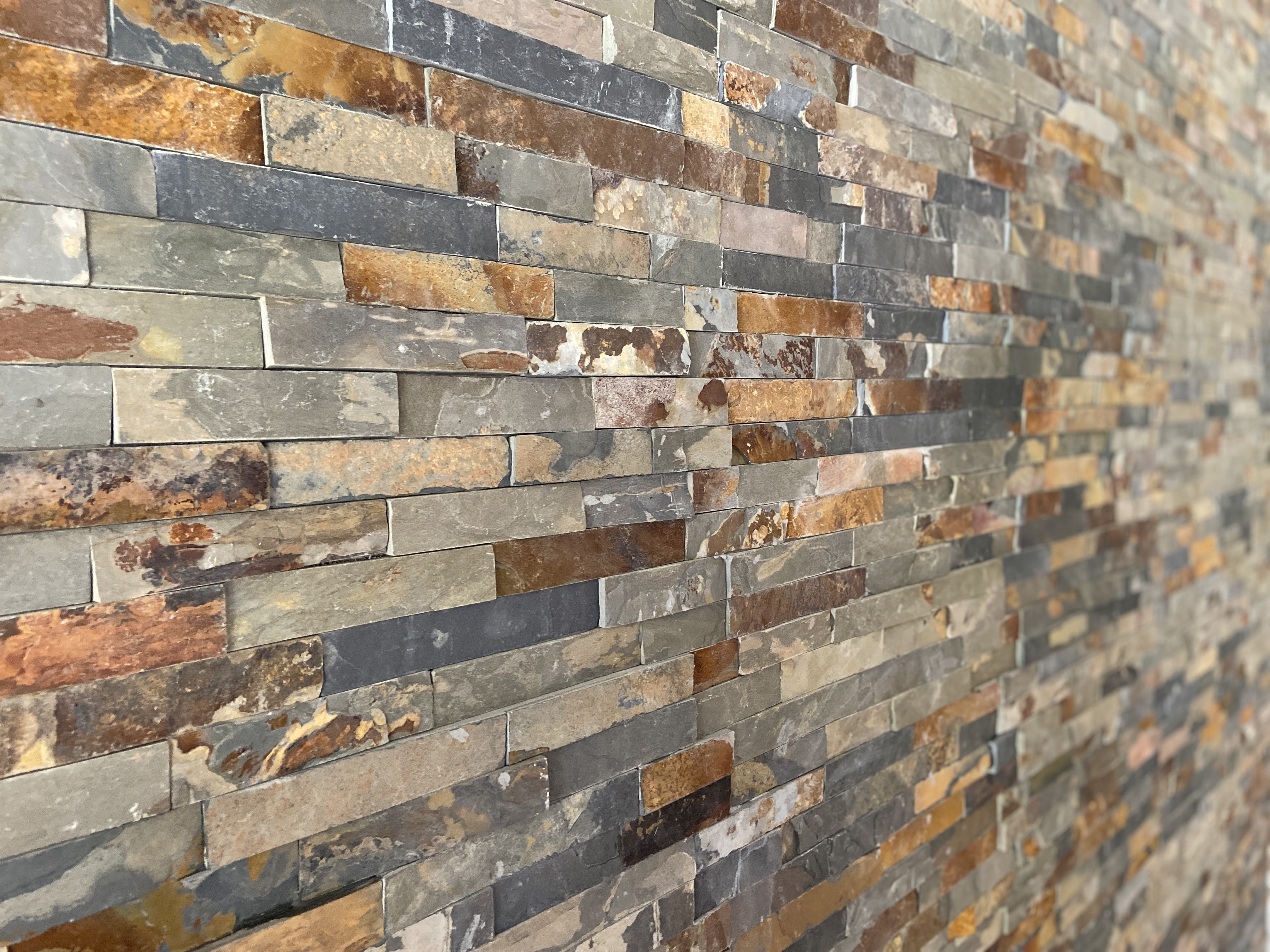 Enhance your home with the natural beauty of this stunning stone accent wall by Ledezma Remodeling. Perfect for a bathroom remodel or home renovation, this textured design adds warmth, character, and a timeless appeal to any space.