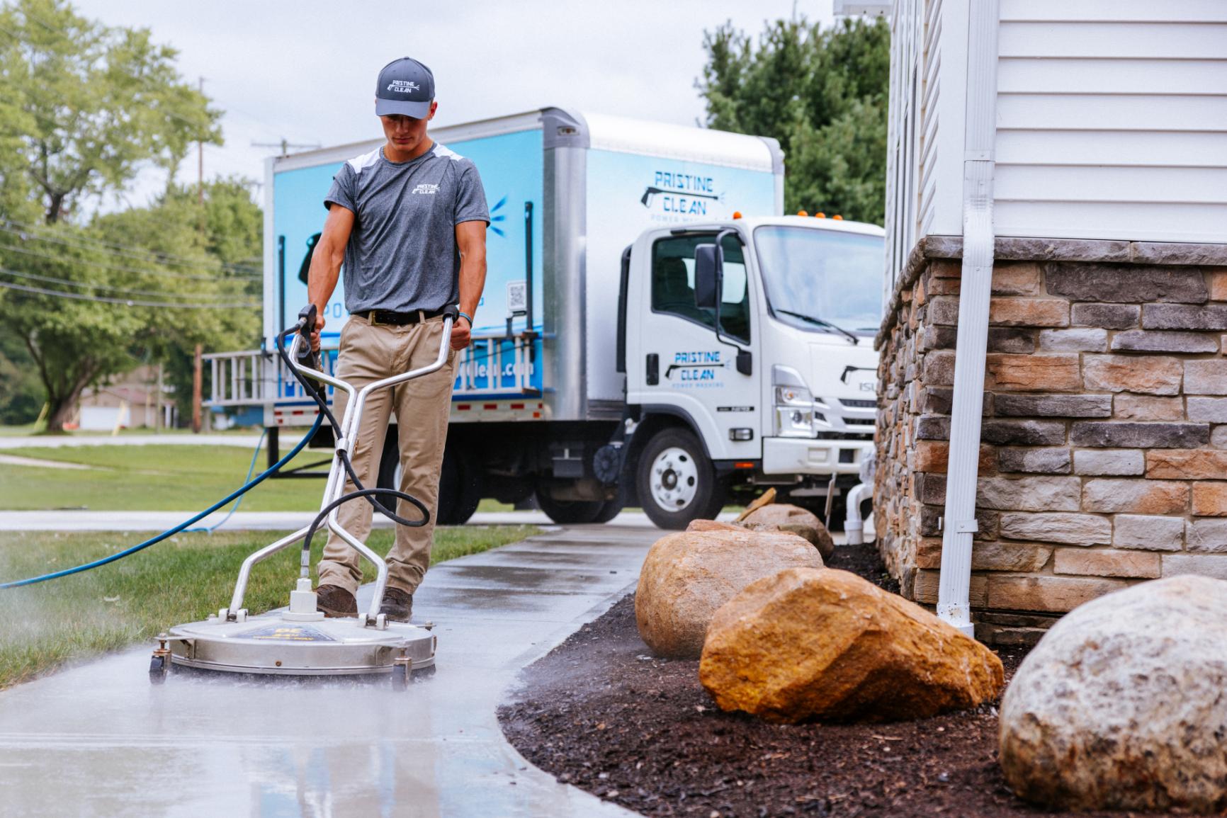 Pristine Clean Employee Concrete Pressure Washing and Sealing