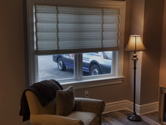 This Valhalla living room chose Roman Shades by Budget Blinds of Ossining to create a relaxing atmosphere. The look is just amazing! Contact us today for your FREE consultation if you are in need of beautiful window treatments. #BudgetBlindsOssining #RomanShades #FreeConsultation #ShadesOfBeauty