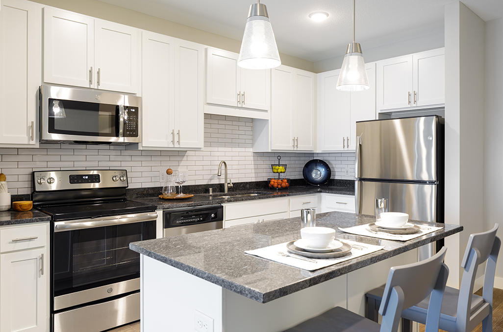 Open Concept Kitchen With Stainless Steel Appliances & Large Island