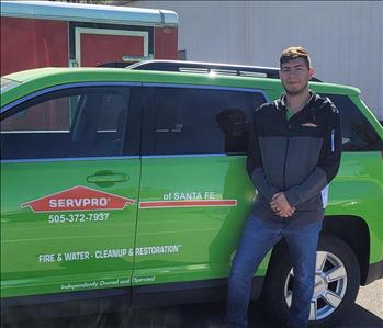 SERVPRO of Santa Fe wrapped business vehicle with business owner.