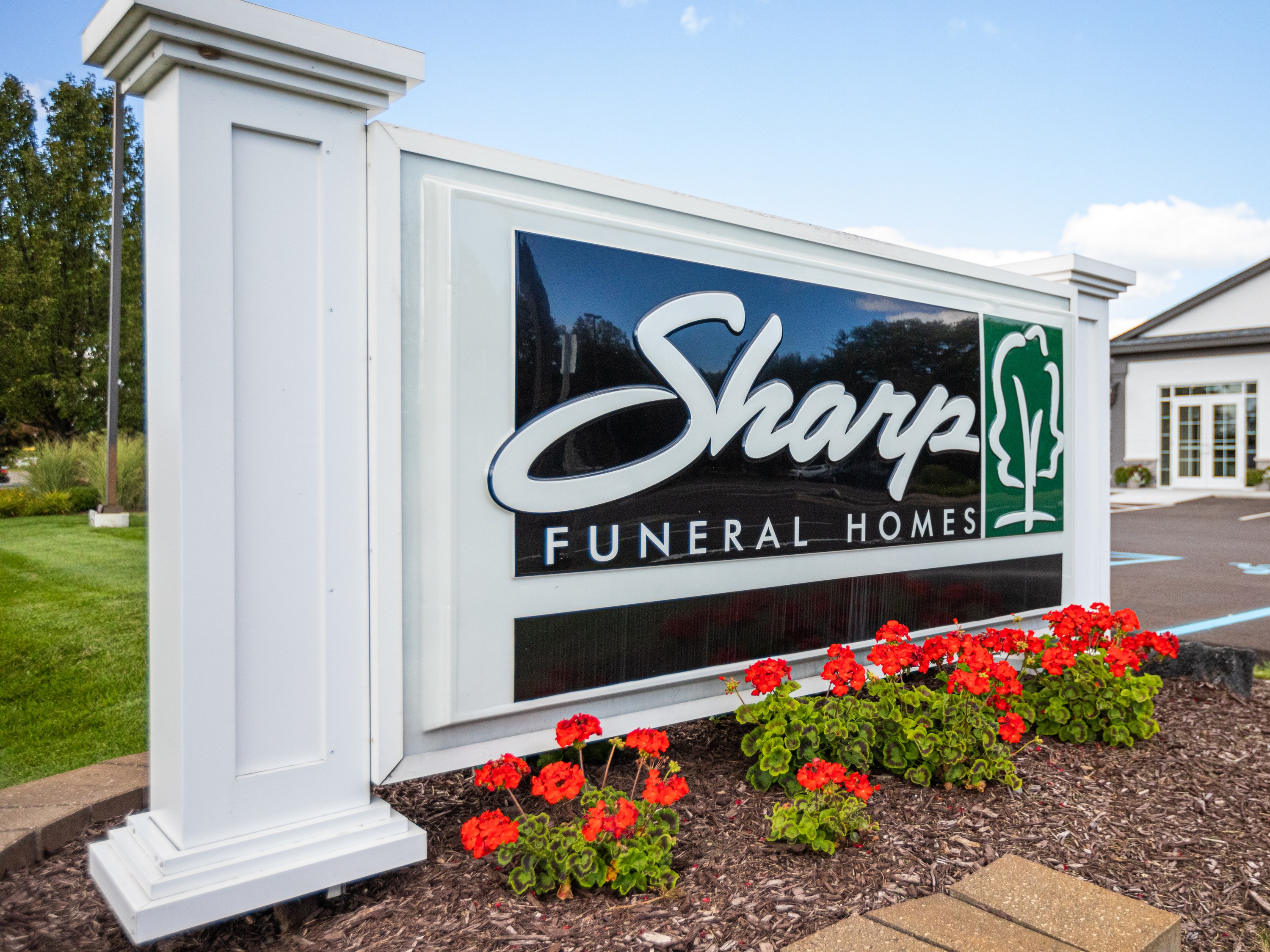 The Sharp sign on Fenton Road marks the Grand Blanc Township funeral home, minutes from Crestwood Memorial Cemetery