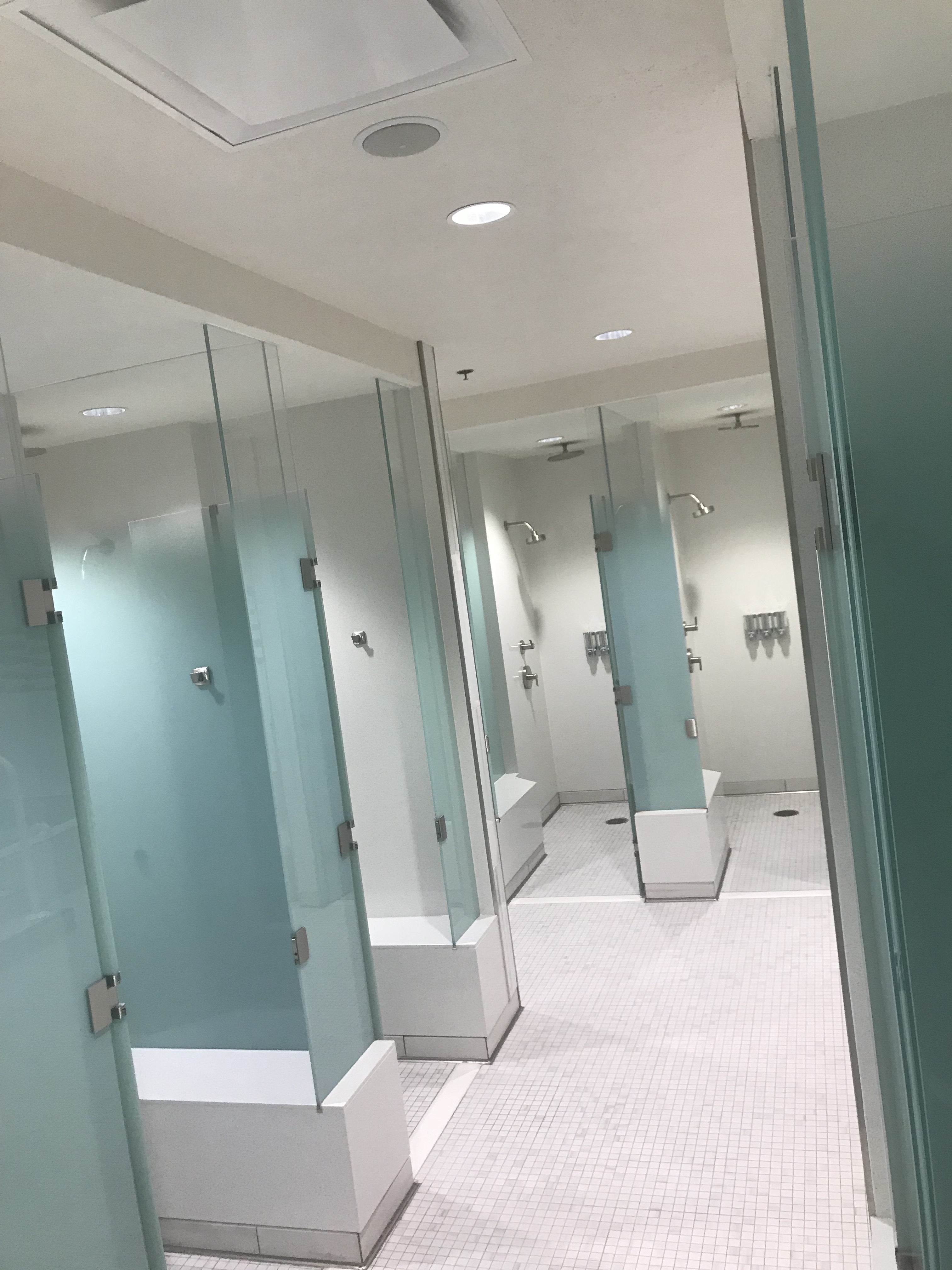 Spa shower area with tiled walls and private changing space