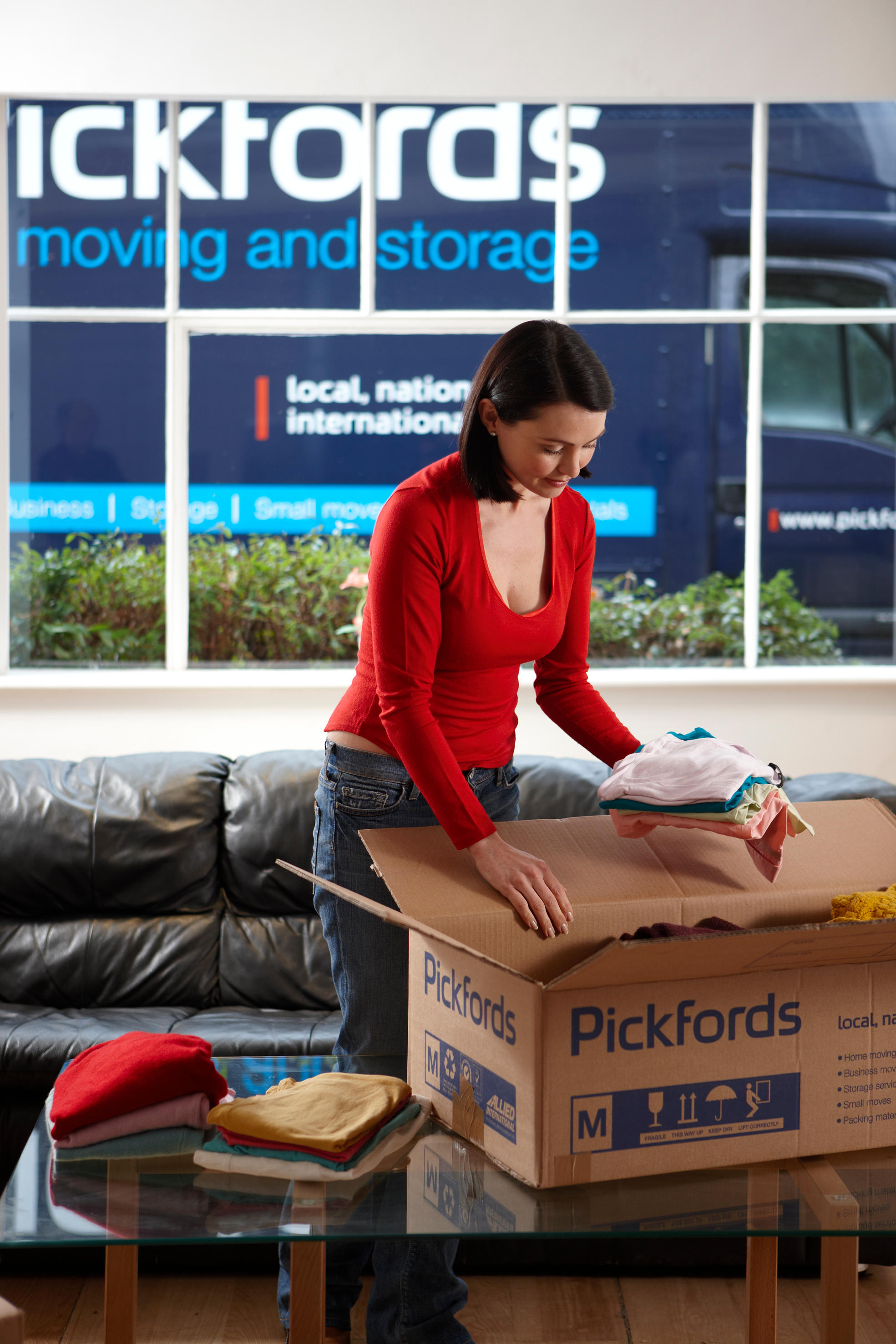 Customer packing using a Pickfords box Pickfords Moving and Storage Leeds 01133 220748