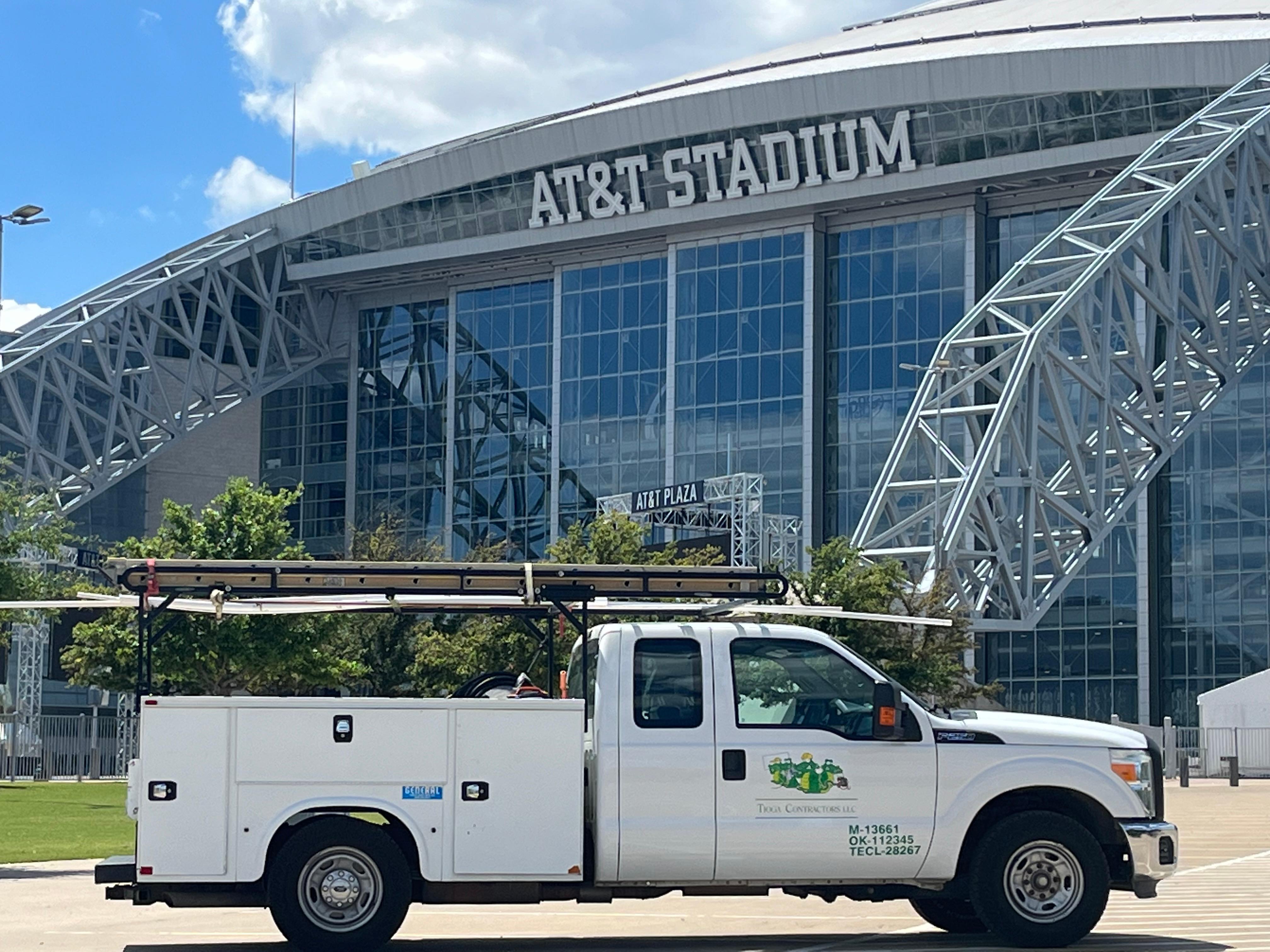 The Tioga Plumbing & Electric parked outside the AT&T Stadium in Arlington Texas.