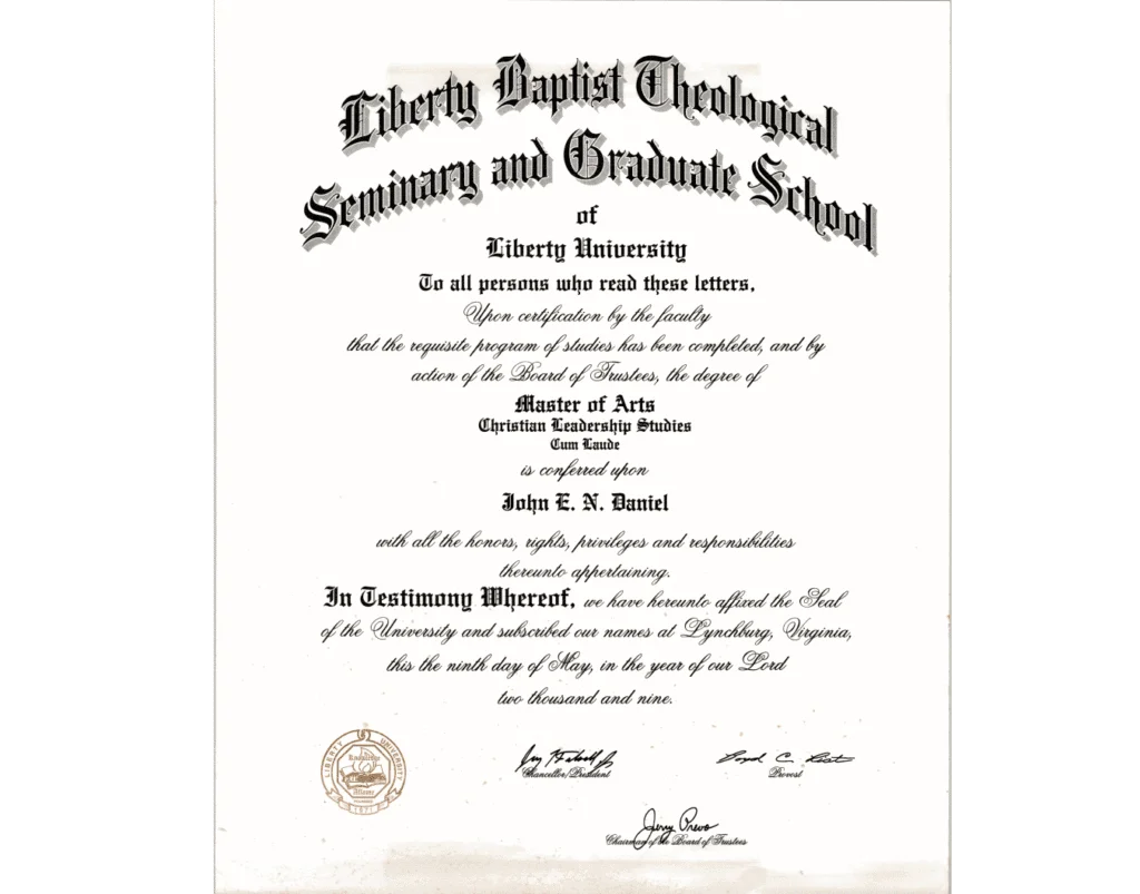 A diploma awarded by Liberty Baptist Theological Seminary and Graduate School of Liberty University to John E. N. Daniel for a Master of Arts in Christian Leadership Studies, Cum Laude. The diploma is dated May 9, 2009, and features the official seals and signatures of the university's officials.