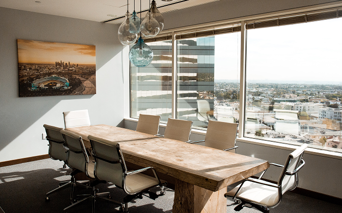 A beautiful boardroom lit by the setting sun.