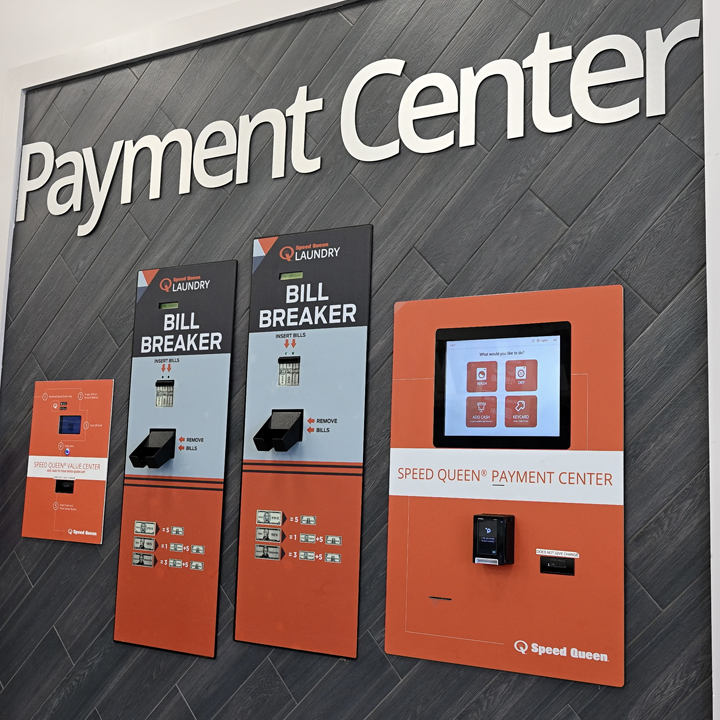Speed Queen Laundry payment center featuring multiple payment kiosks for customers to conveniently p 