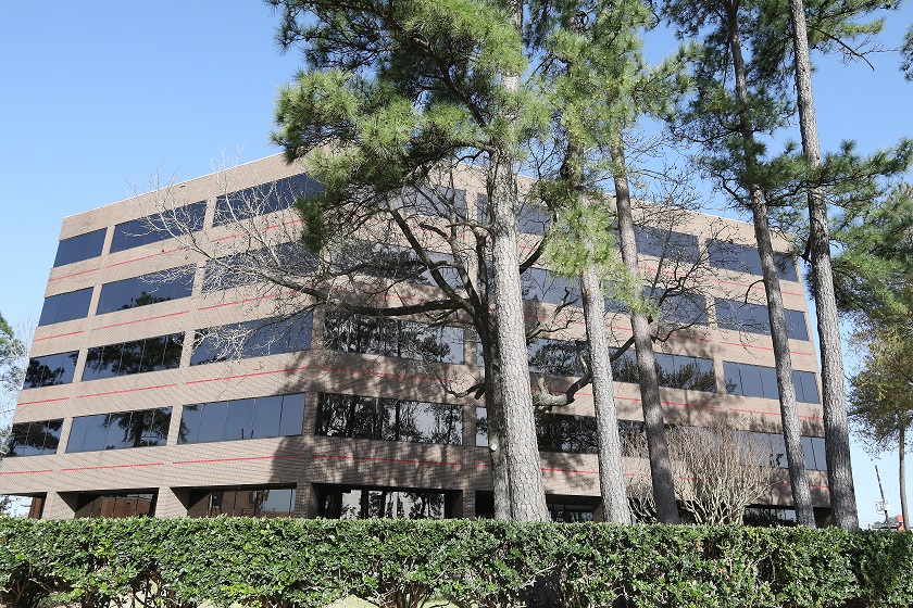 The photo of the back view of the building of our Houston office showcases a well-maintained and spacious area that is designed with our clients' comfort and convenience in mind. The building's modern and sleek design is evident from this angle, with clean lines and large windows that provide ample natural light to the interior.