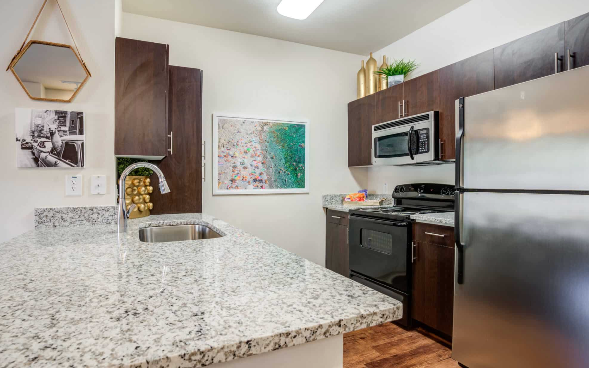 Beautiful open kitchen with stainless steel appliances and granite countertops