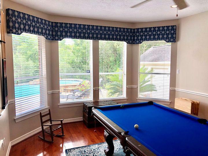 Decorate every inch of your Richmond, TX home. Pair this Custom Cornice tie with a set of bay windows together in your game room to give it pizzazz. #BudgetBlindsKatySugarLand #CustomCornice #FreeConsultation #RichmondTX #WindowWednesday