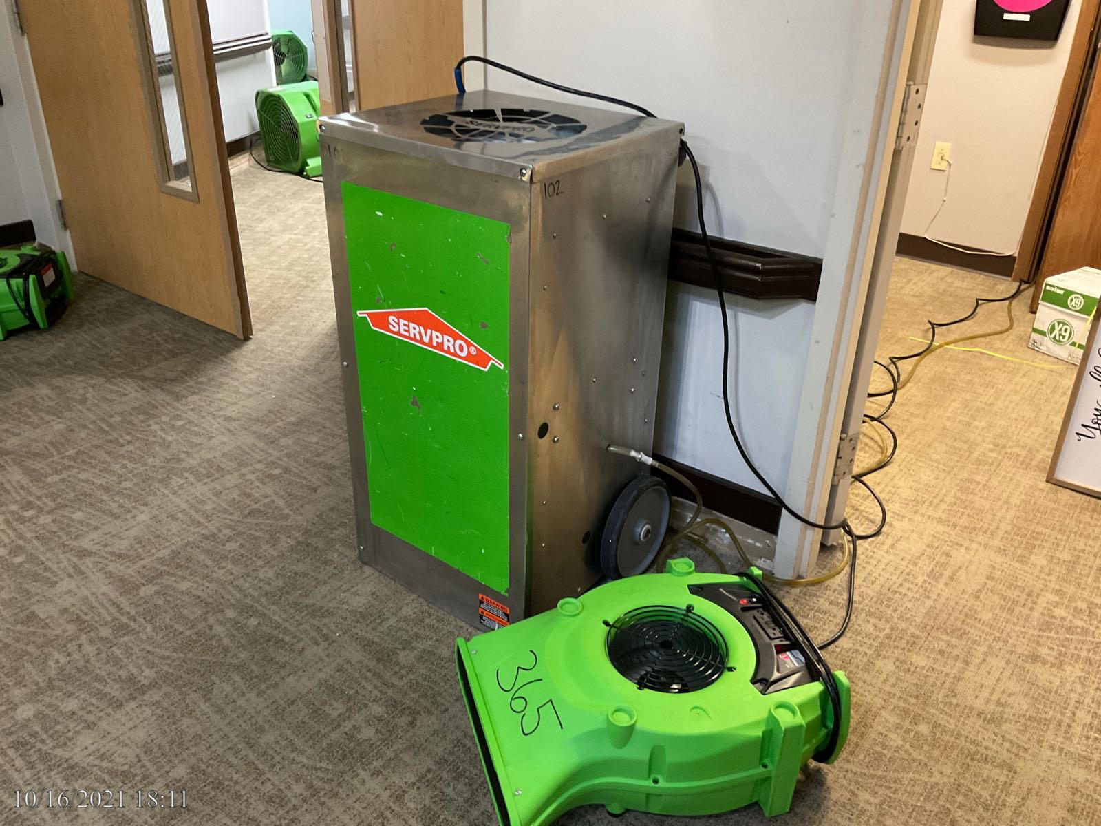SERVPRO of South & East Stark County dehumidifier and fan drying a commercial building.