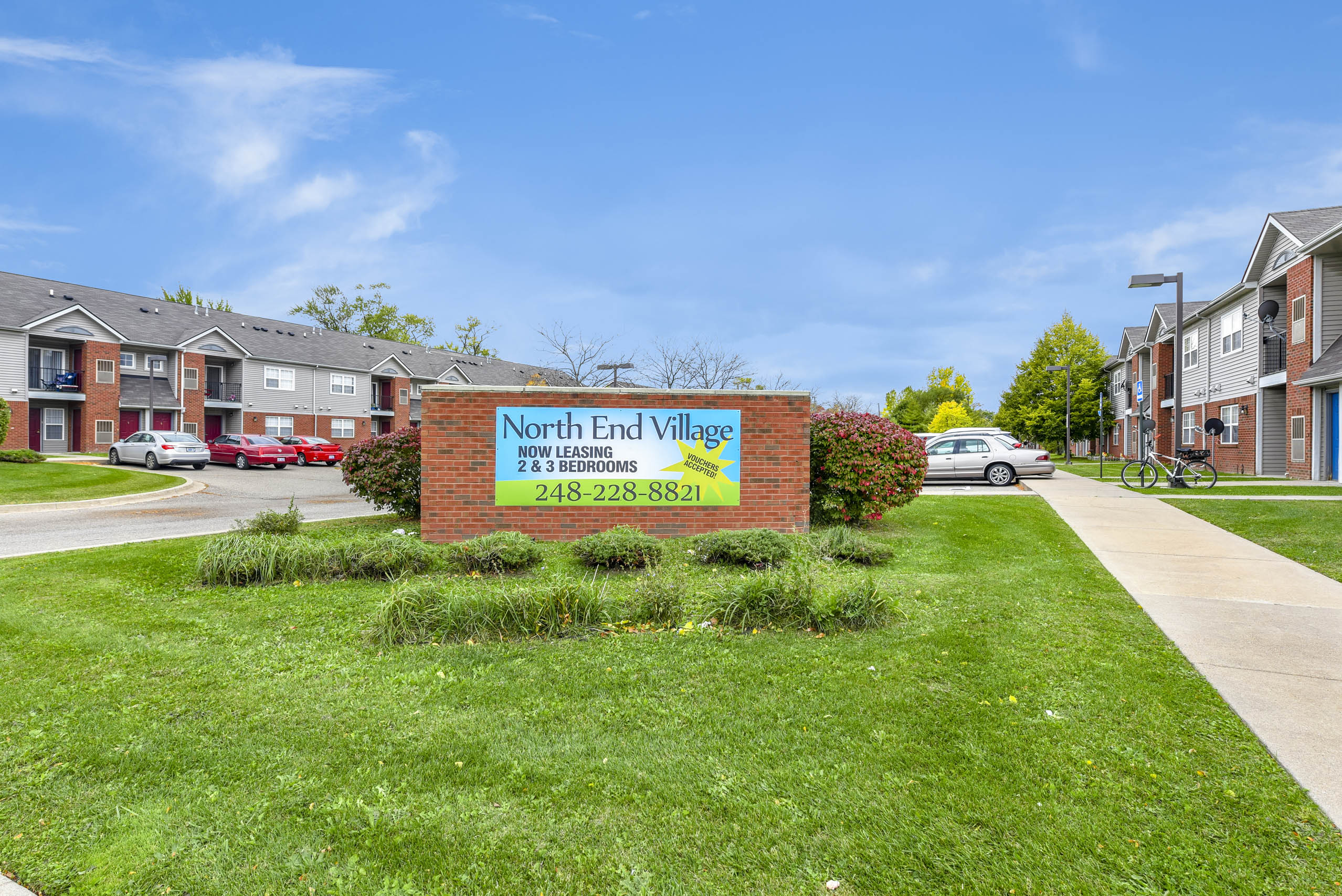 A sign for North End Village