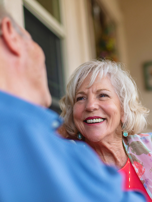 Lady smiling at her husband and talking about PD catheter placement