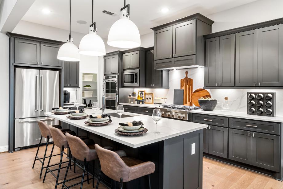 Gourmet kitchen with pendant lighting, premium stainless steel appliances, and walk-in pantry Pecan Ridge - Select Collection Fulshear (346)362-1600