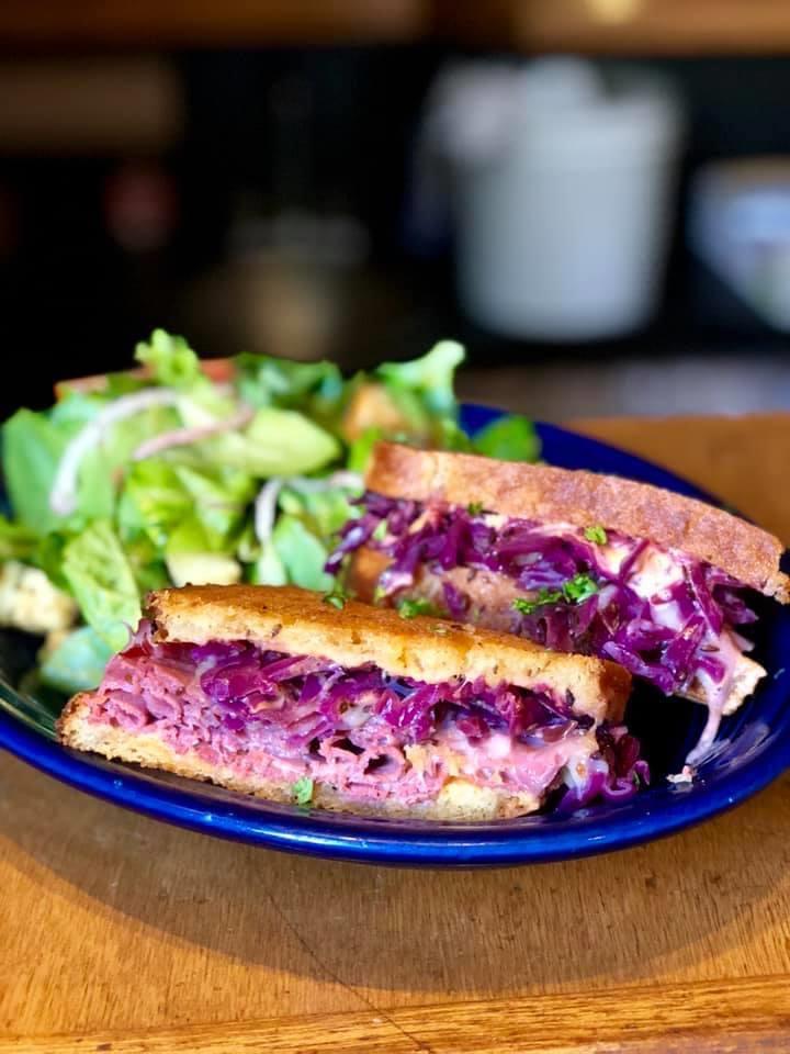 Our signature Red Reuben, made with house pickled red cabbage and all the fixins'.