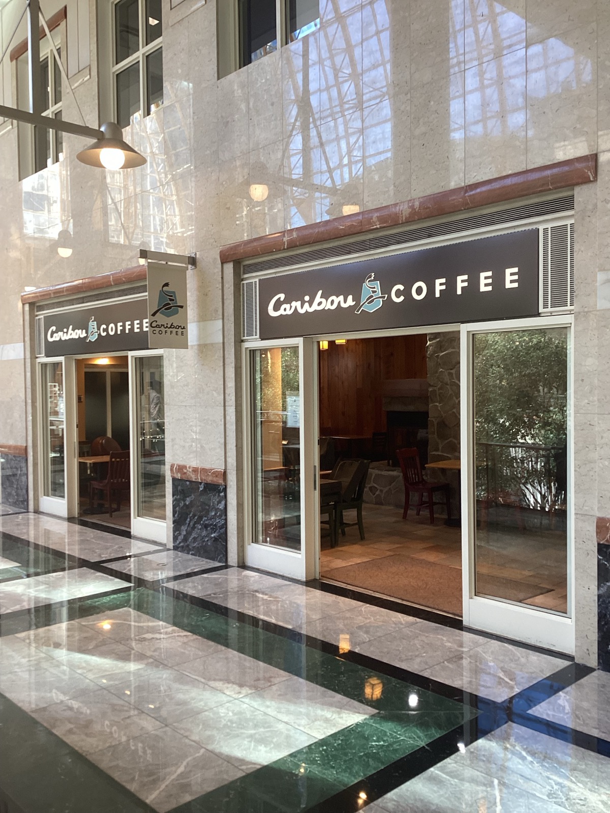 Storefront of the Caribou Coffee at 100 North Tryon Street in Charlotte