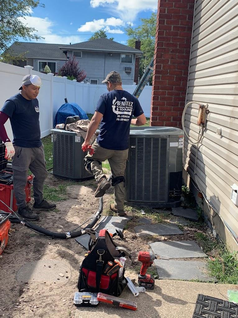 HVAC contractors replacing AC unit