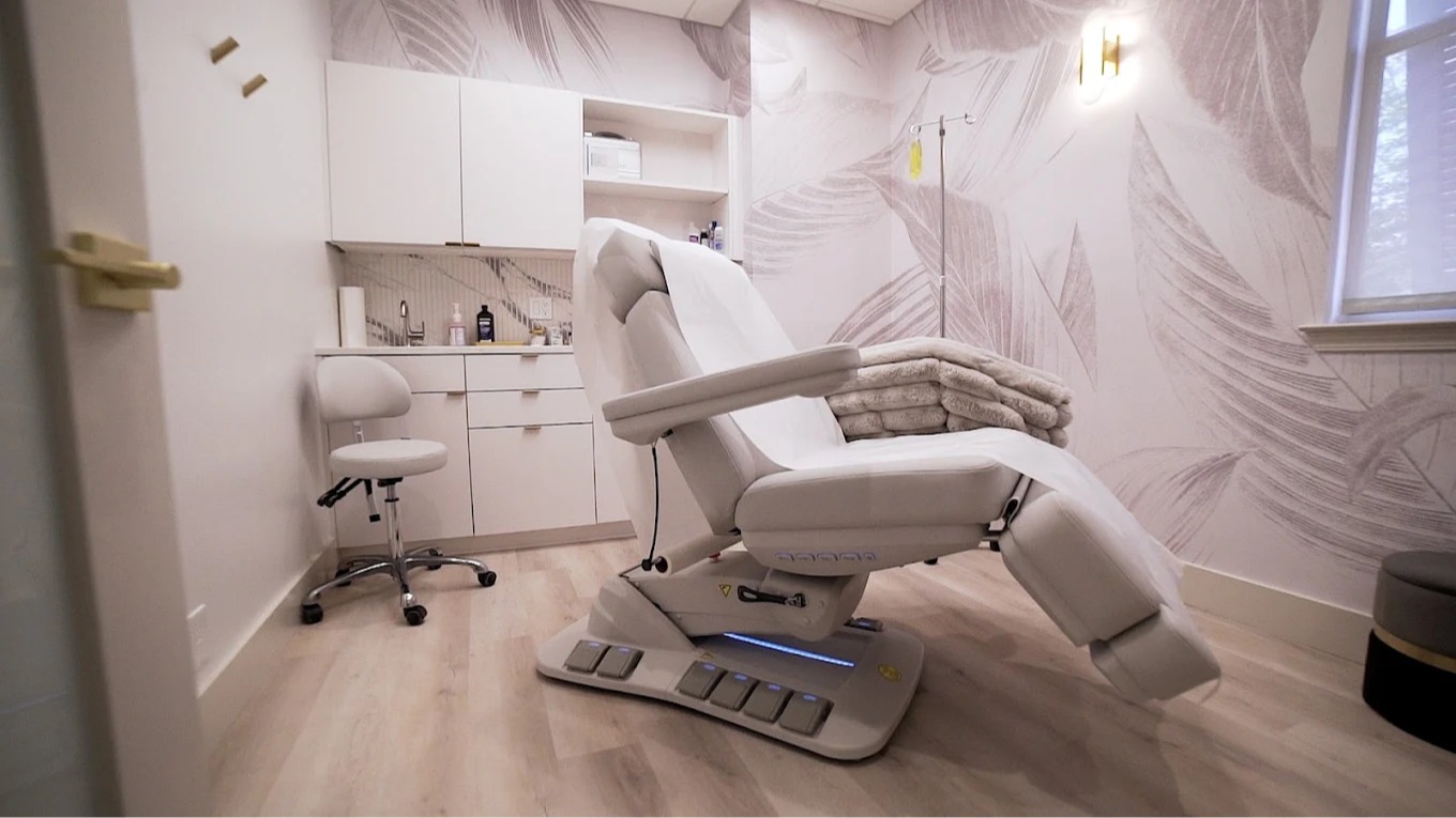 Fully adjustable medical-grade procedure bed for aesthetic injections in Miramar Beach Florida.