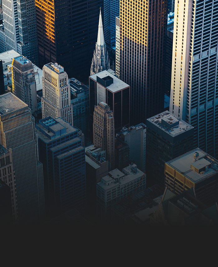 An aerial shot of a downtown core with skyscrapers.