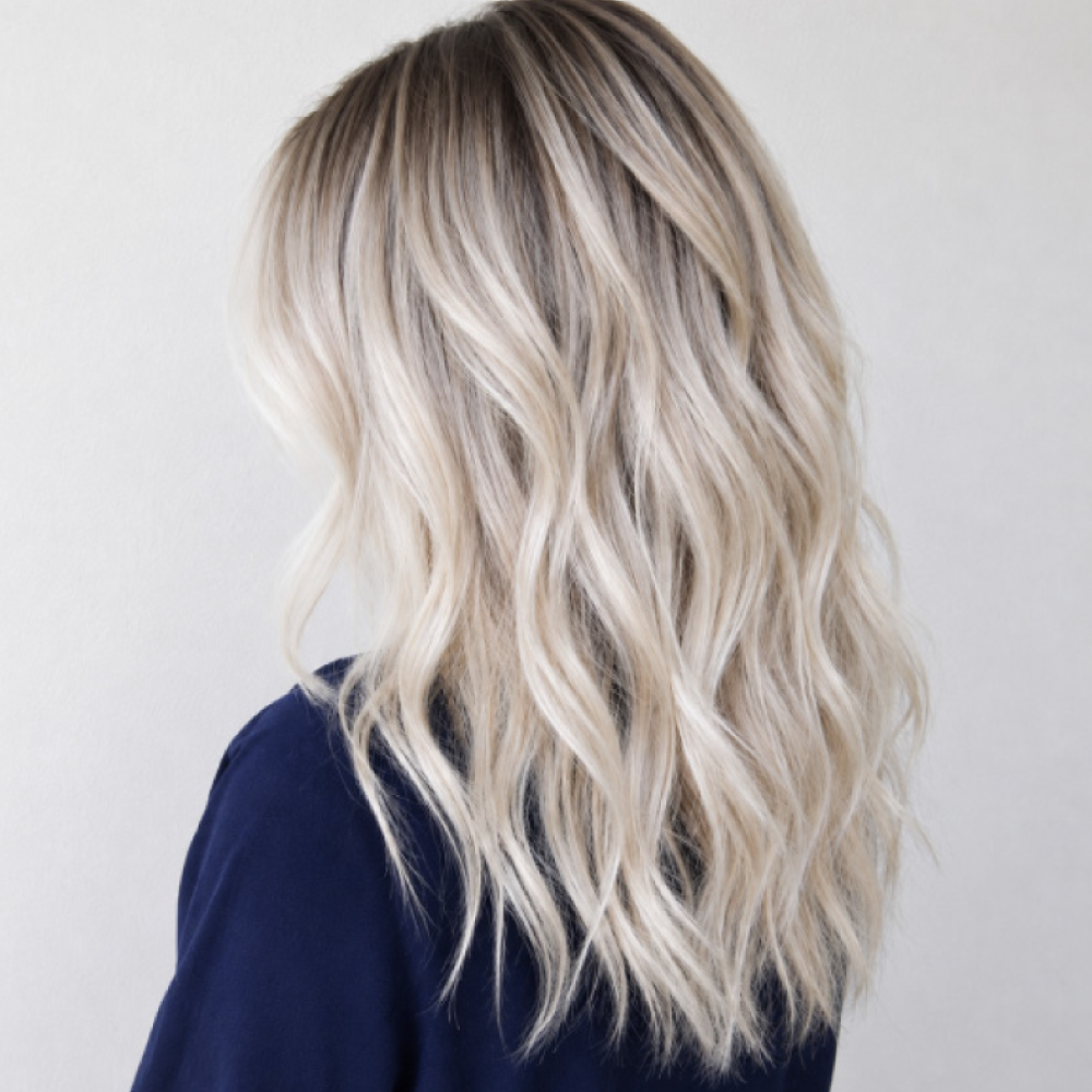 Expert platinum blonde hair color and precision haircut at Avissa Salon in Ann Arbor create a bright 