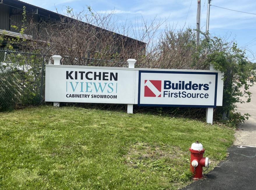 Entrance to Builders FirstSource and Kitchen Views cabinetry showroom, featuring signage for building materials, custom cabinetry, and home improvement solutions. The location serves contractors, builders, and homeowners looking for top-quality lumber, millwork, and cabinetry for residential and commercial projects.