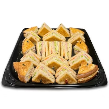 Turkey, ham, bacon, cheddar, provolone, lettuce, tomatoes, mayo and honey mustard, layered on three slices of wheat berry bread.