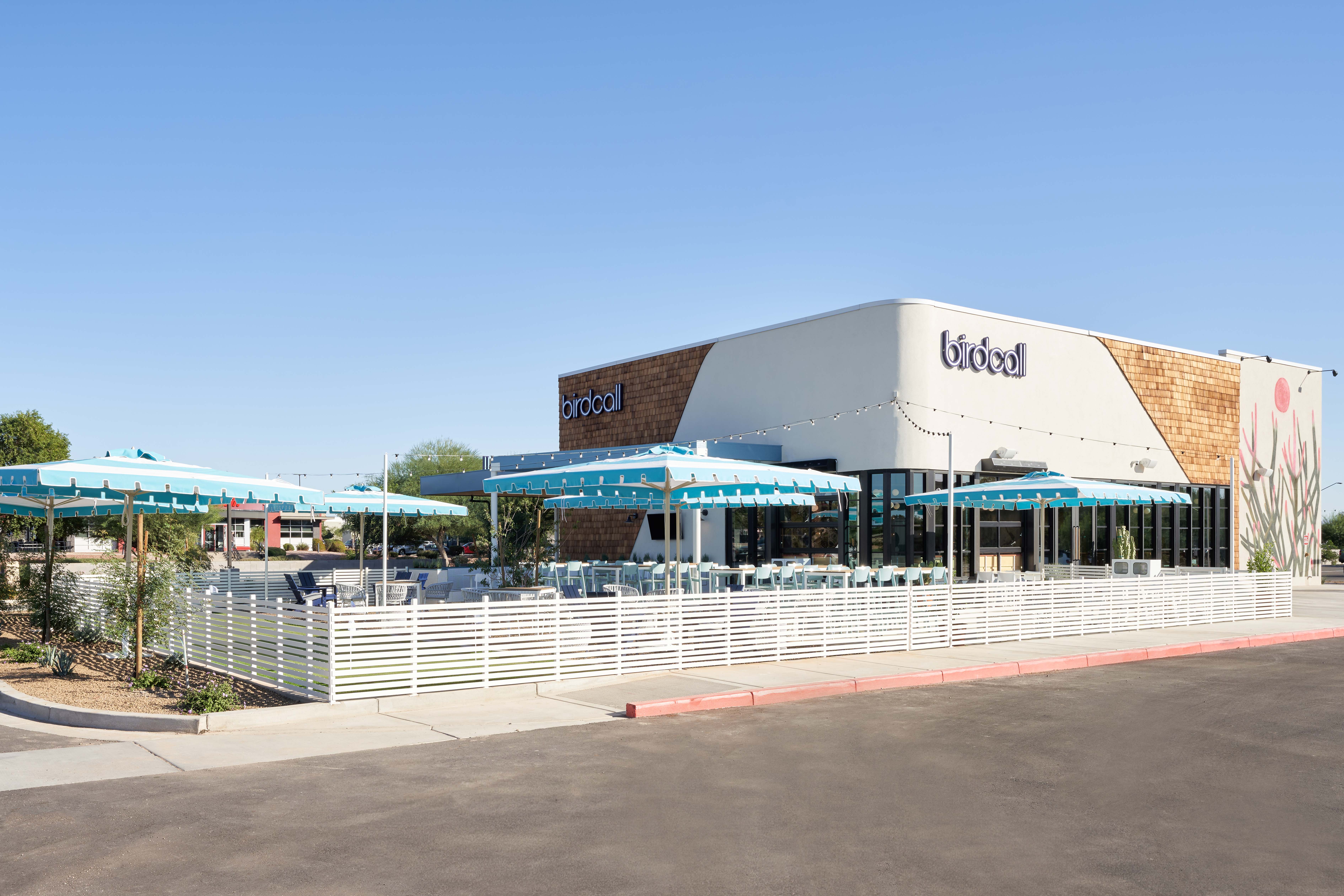 Full exterior of Birdcall SanTan Village, highlighting the putting green, spacious patio, and large dining room.