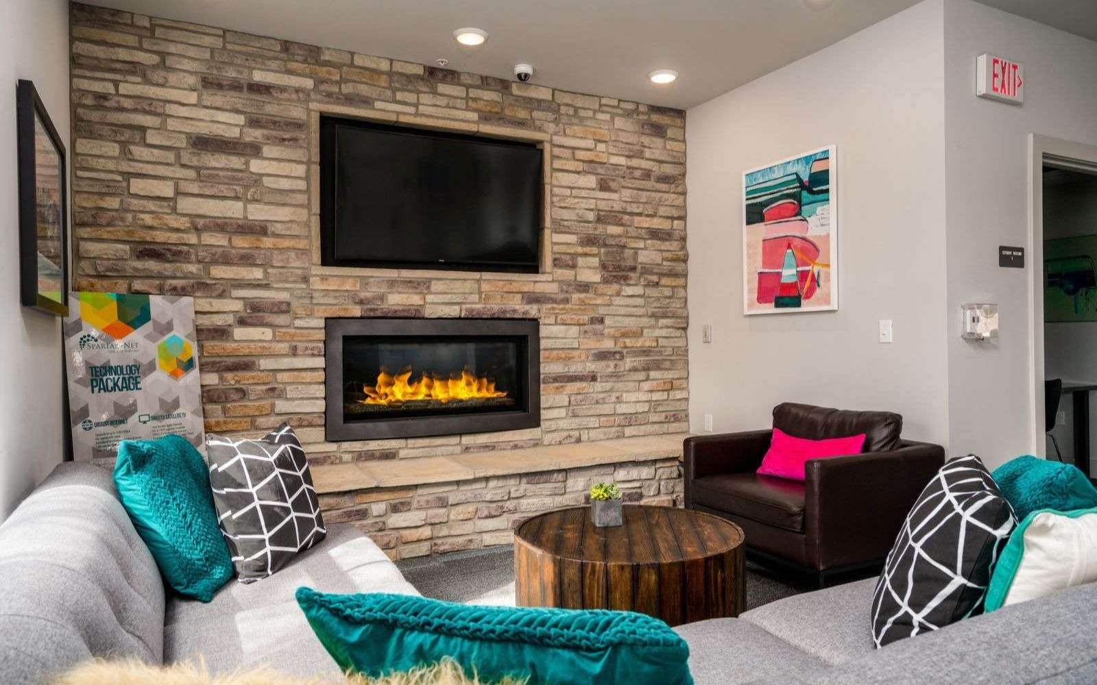 Community Lounge with Stonewall Fireplace and TV
