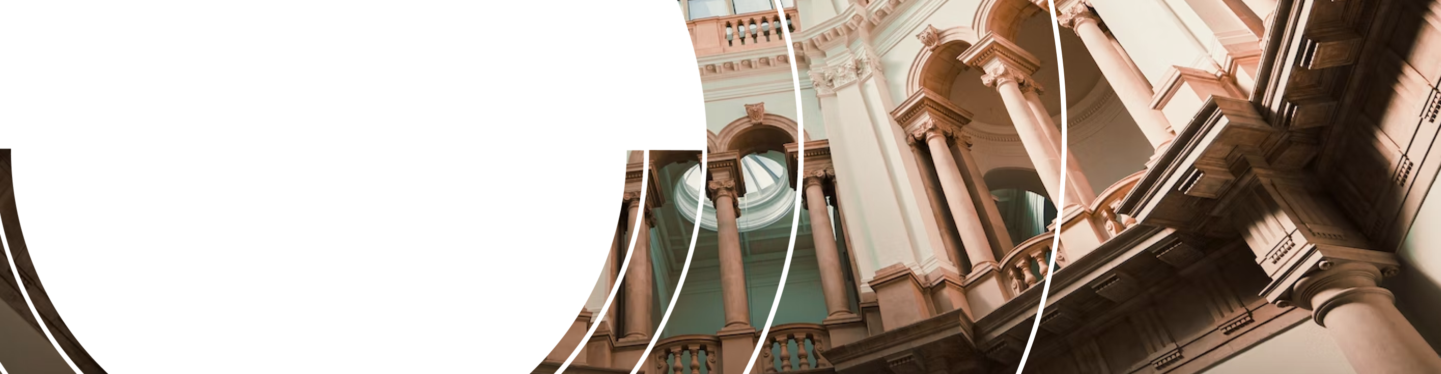 Bottom-up view of the interior of a rotunda with classical architecture.