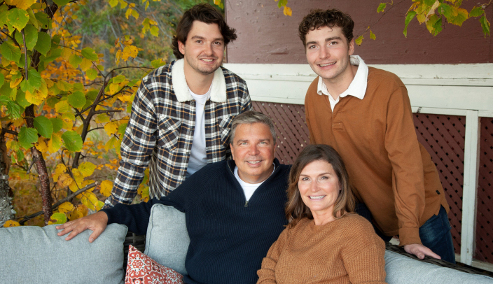 Brian, Jacqueline, and their kids posing.