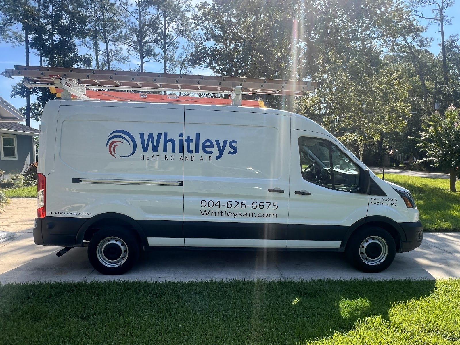 A white Ford Transit van with 