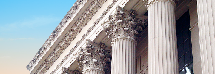 Close-up of a building with Roman columns.