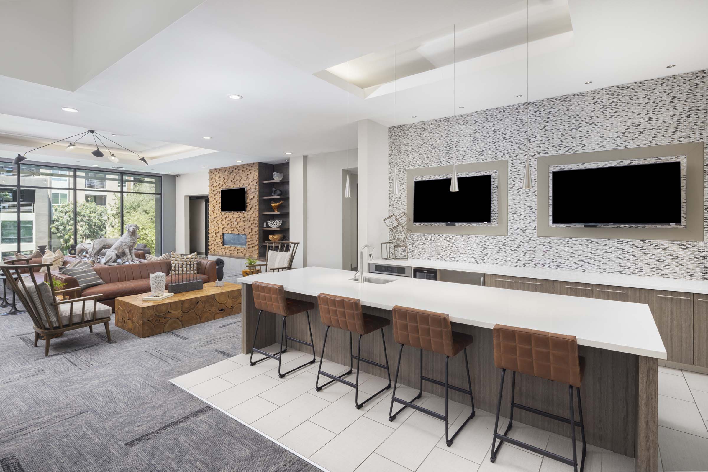 Second floor resident lounge kitchen with TVs at Camden Tempe apartments in Tempe, AZ